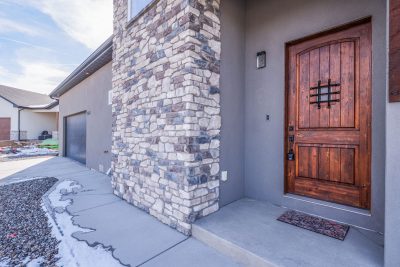 Entryway of a custom-built home for sale in Montrose, Colorado featuring natural light and mountain home design