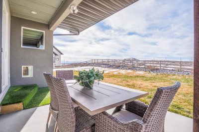 Outdoor living area with unobstructed San Juan Mountain views at a home for sale in Montrose, Colorado